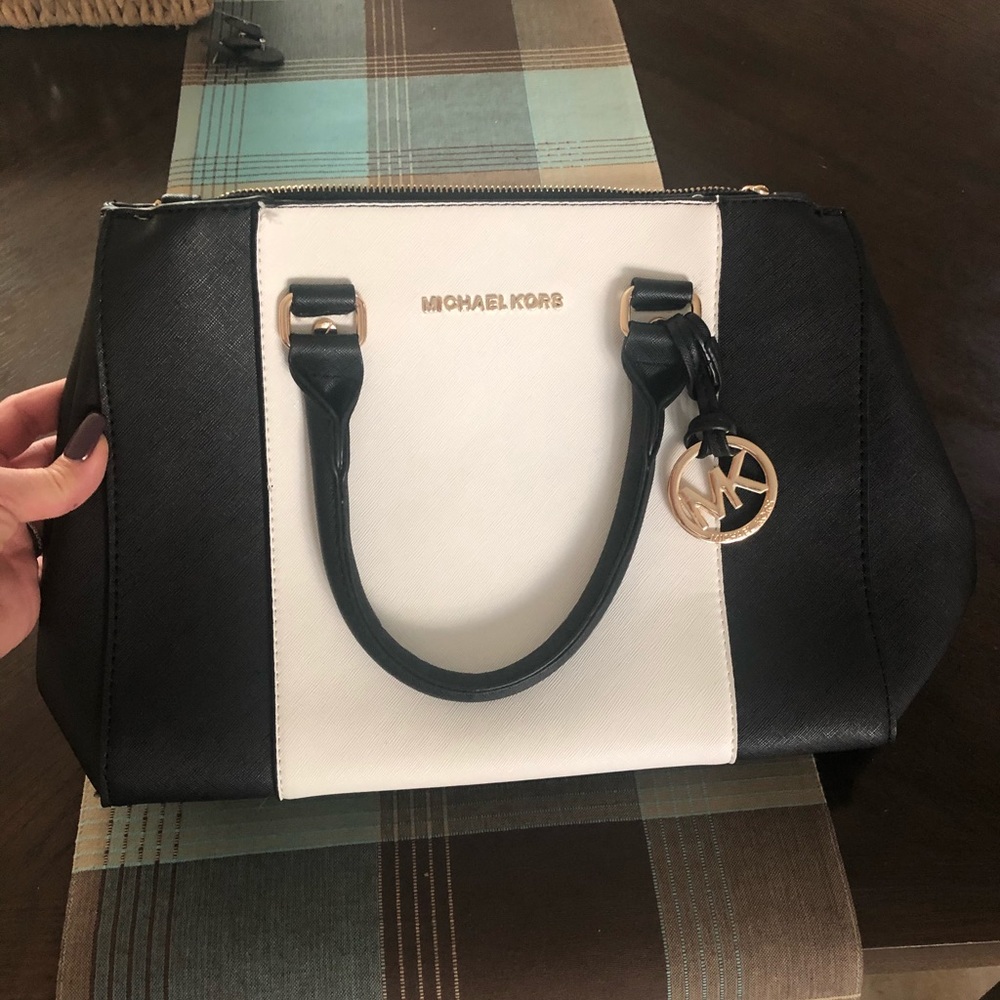 Black and white probably not authentic mk purse